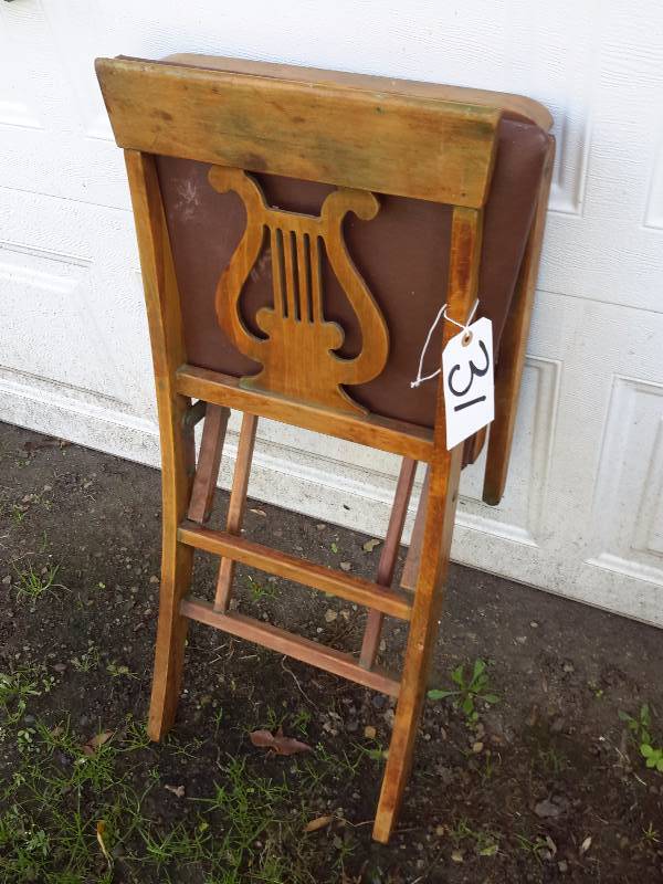 lot 31 image: Folding Music theme chair.. Maple wood