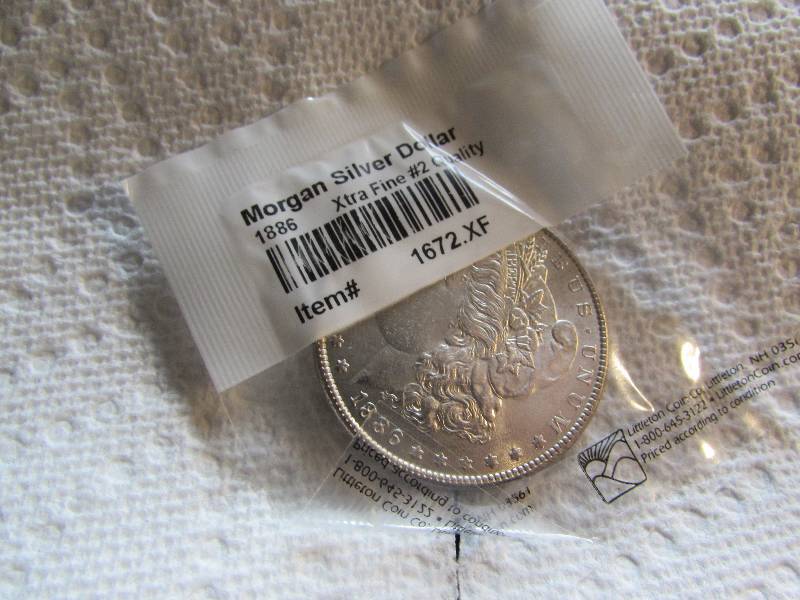 1886 MORGAN SILVER DOLLAR, EXTRA FINE #2 QUALITY, 90% SILVER, LITTLETON COIN COMPANY PKG
