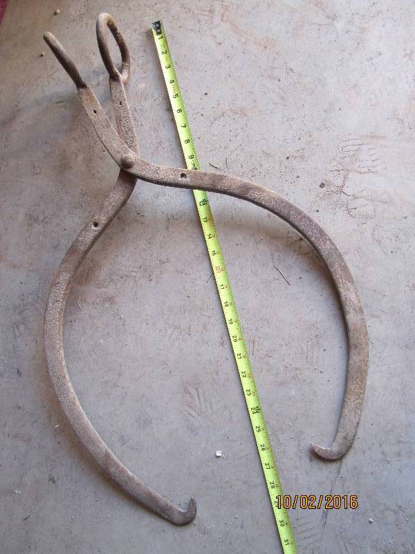 lot 11 image: Antique ice tongs...