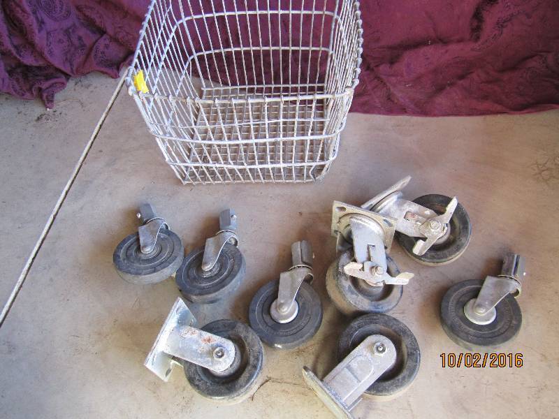 lot 59 image: Antique metal basket of wheels...