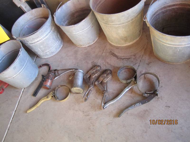 lot 77 image: metal pails and oil change supplies...