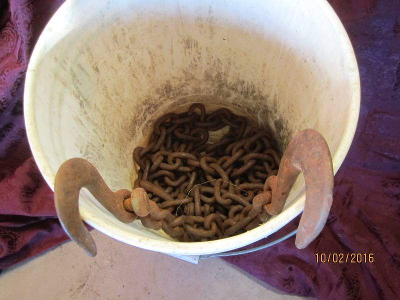 lot 92 image: Bucket of chain with hook ends...