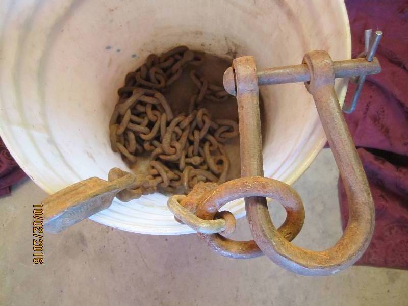 lot 95 image: Bucket of chain with hook ends...
