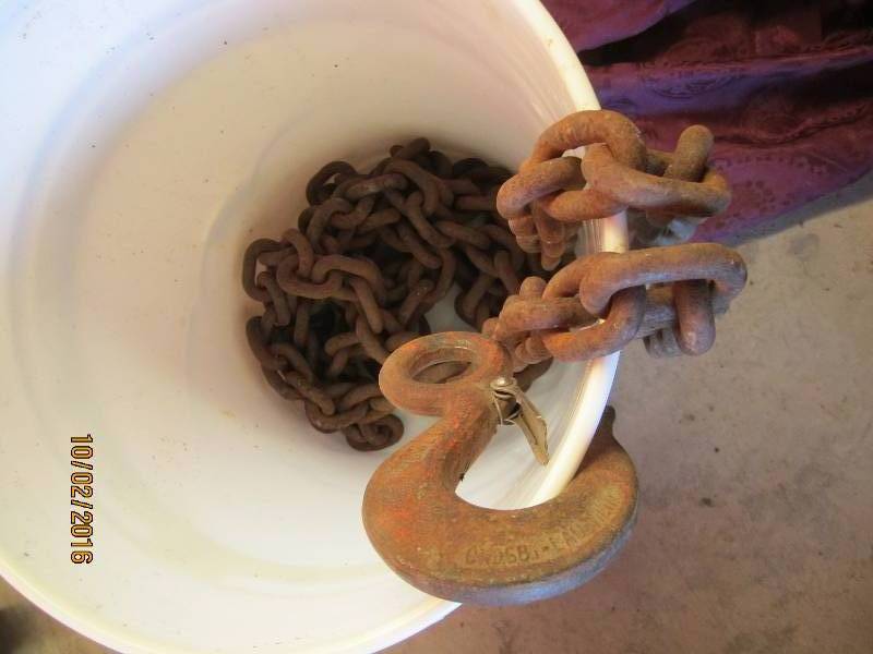 lot 96 image: Bucket of chain with hook ends...