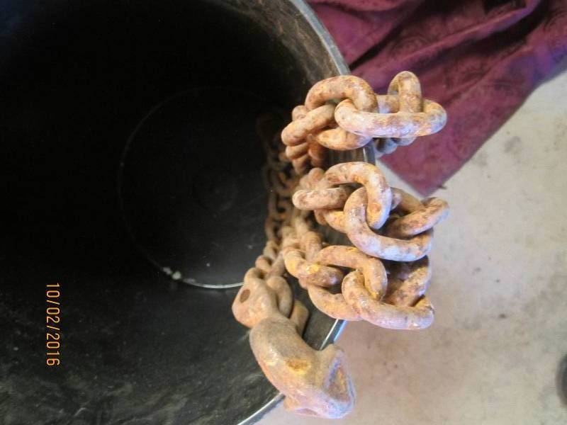 lot 97 image: Bucket of chain with hook ends...