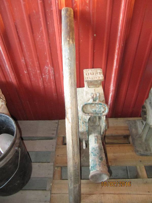 lot 102 image: Antique tractor jack with wood hand...