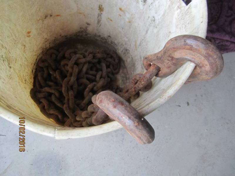 lot 123 image: Bucket of chain with hook ends...