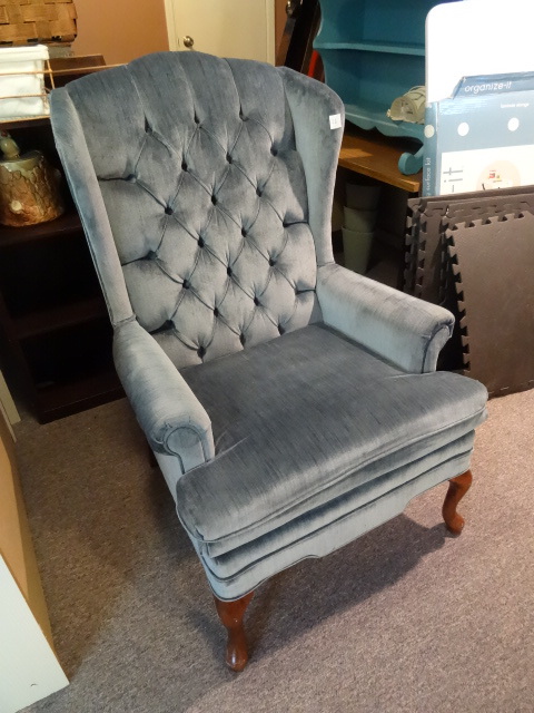 High back cushioned chair