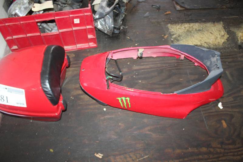 lot 81 image: Lot of Motorcycle Parts Including Seat Back, Tank Cover