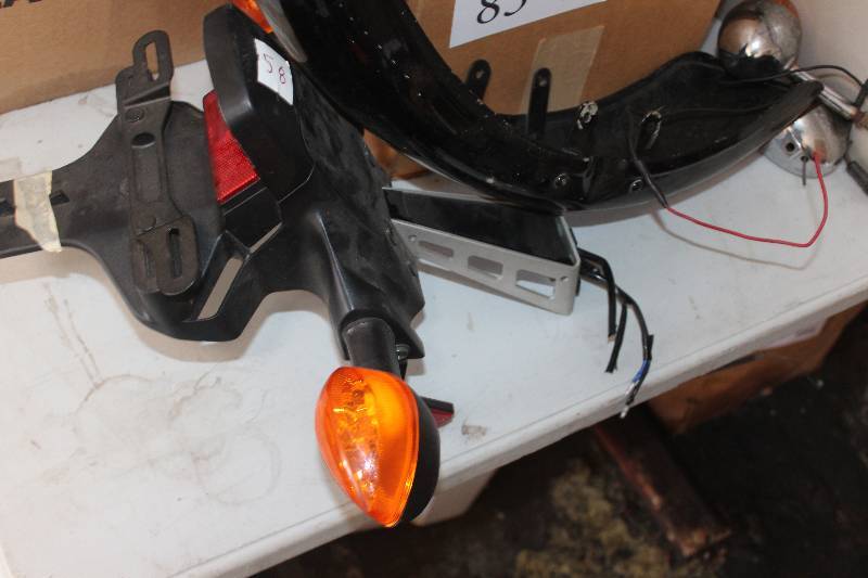 lot 82 image: Lot of Motorcycle Parts Including Lighting, Fenders, And More