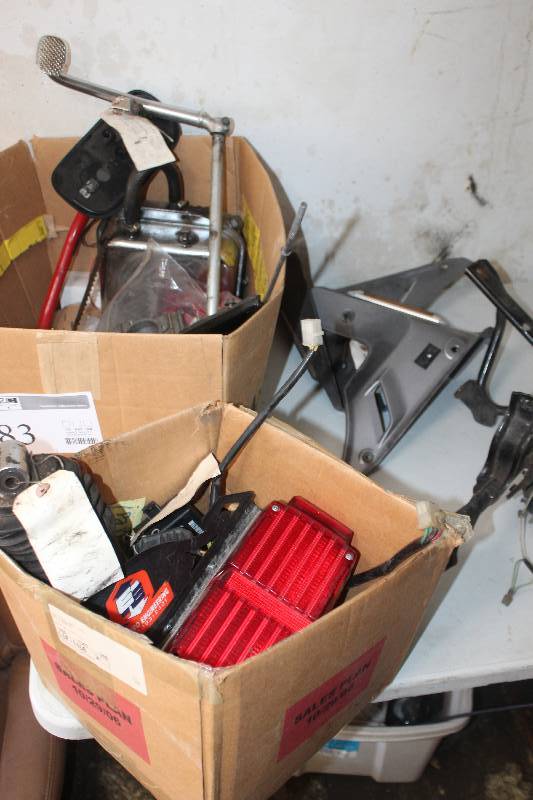 lot 83 image: Lot of 1982 Honda Silverwing Motorcycle Parts Including Rear Shock Absorber, Voltage Regulator, Fairing Mount, Right & Left Lower Fairing, Rear Brake Pedal Pivot Linkage