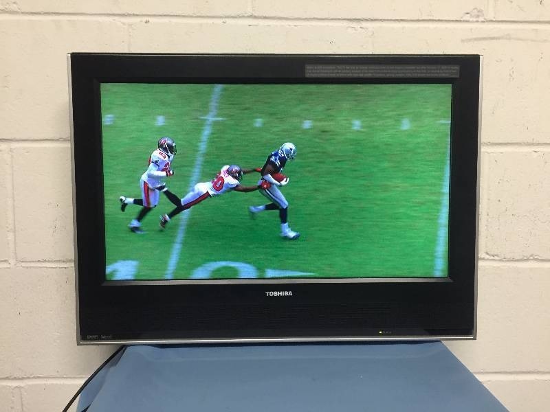 lot 18 image: Toshiba 23 Flat Panel LCD TelevisionTV with Built-in DVD Player