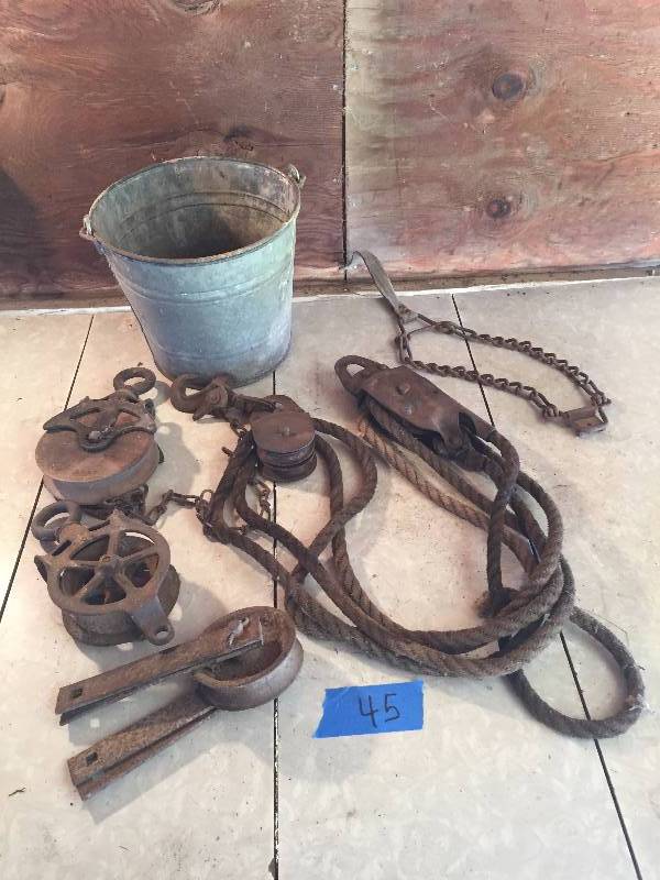 OLD PULLEYS AND HAY EQUIPMENT