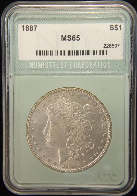 1887 MORGAN SILVER DOLLAR CERTIFIED MS65 BY NTC