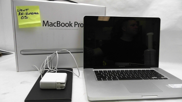lot 810 image: 15 Macbook Pro Locked HD See Description