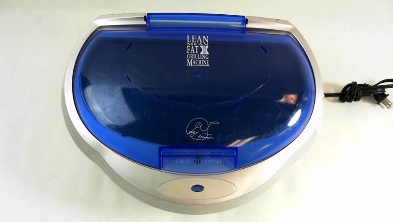 lot 243 image: George Foreman Lean Mean Fat Grilling Machine. Model GR15BWI