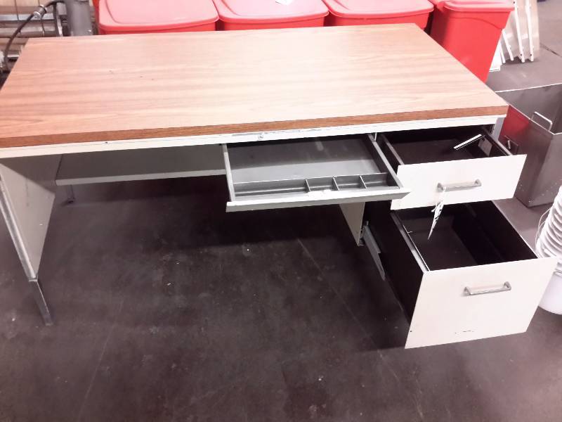 Metal desk with simulated wood top.. 60in x 30 in x 29 12 in h..