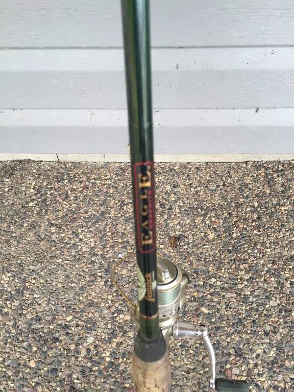 lot 9 image: FISHING ROD AND OPEN FACE REEL