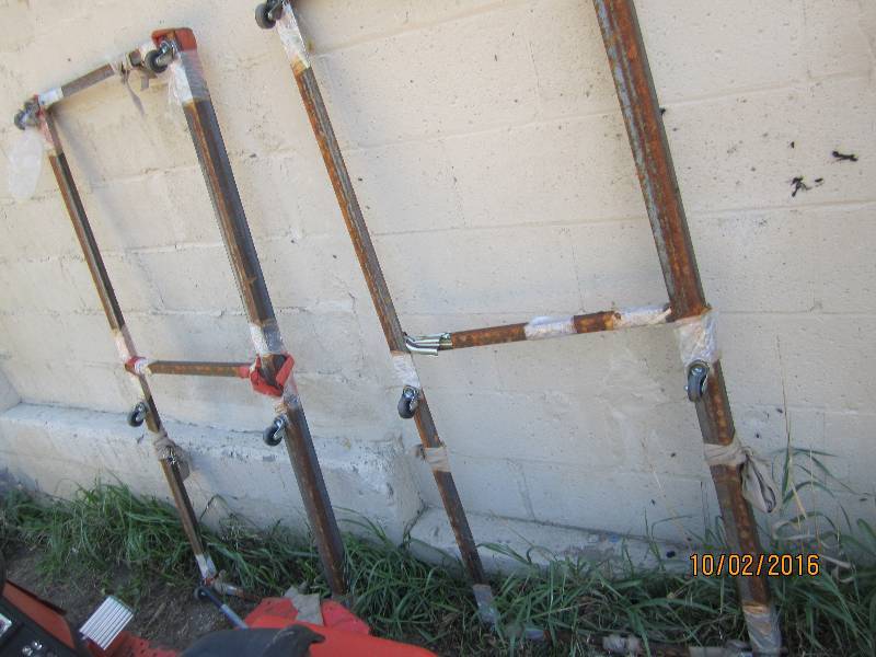 lot 36 image: 2 steel bases on wheels, 27 x 63...