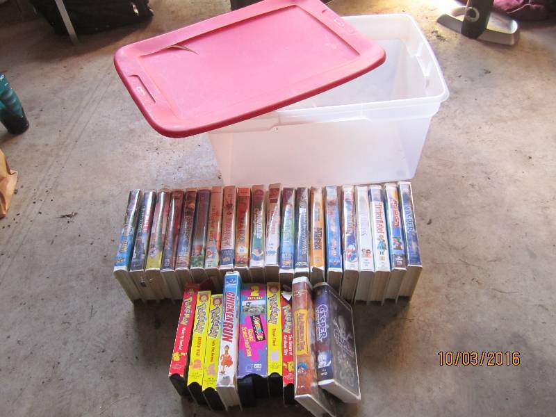 lot 62 image: Sterilite tote of kids movies...