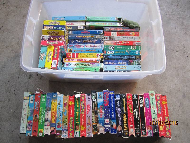 lot 63 image: Sterilite tote of kids movies...