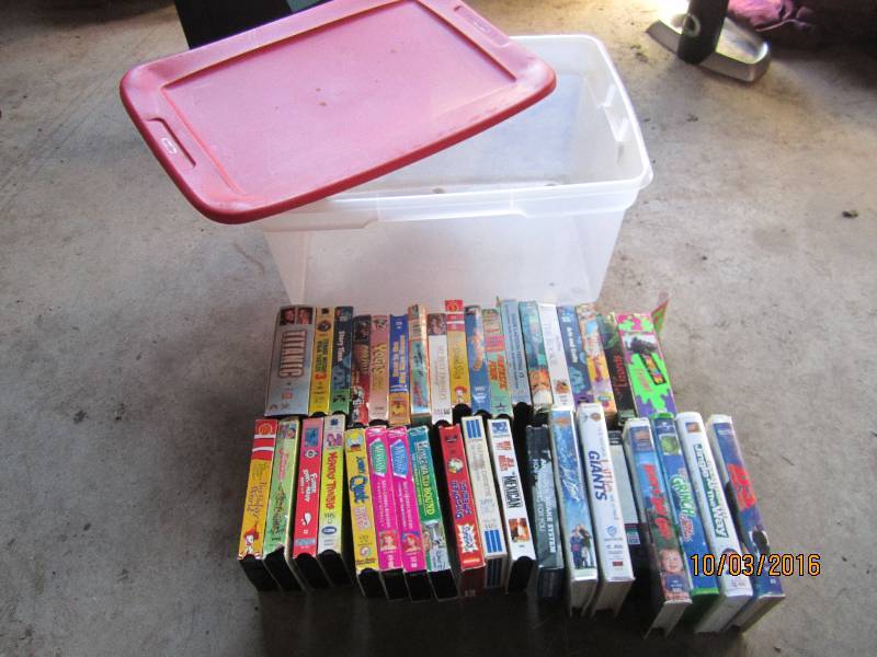 lot 64 image: Sterilite tote of kids movies...