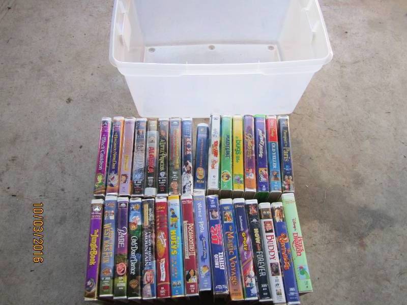 lot 67 image: Sterilite tote of kids movies...