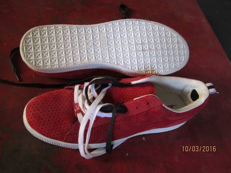 lot 140 image: New Puma size 12 shoes...