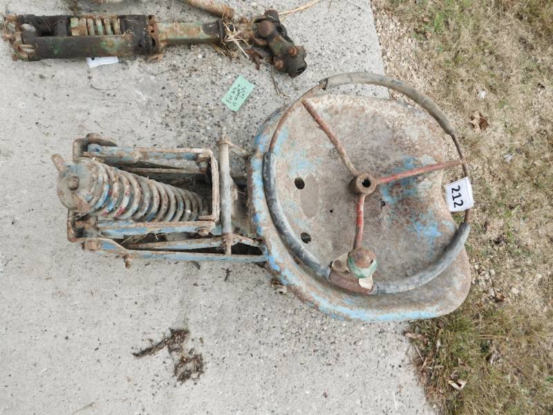 lot 212 image: farm implement seat and a steering wheel