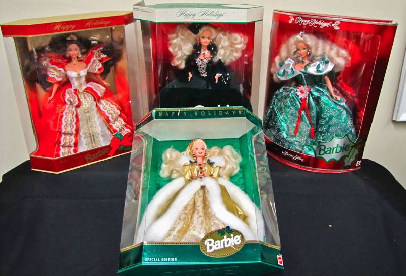 lot 101 image: 4 Holiday Barbies in Original box