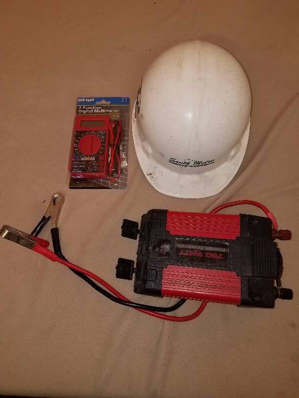 lot 50 image: Hard Hat, Electrical Tester and A 750W Power Inverter