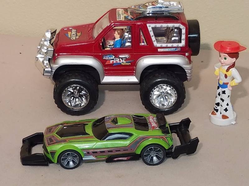 lot 112 image: Truck, Hot Wheel car and Toy Story figurine