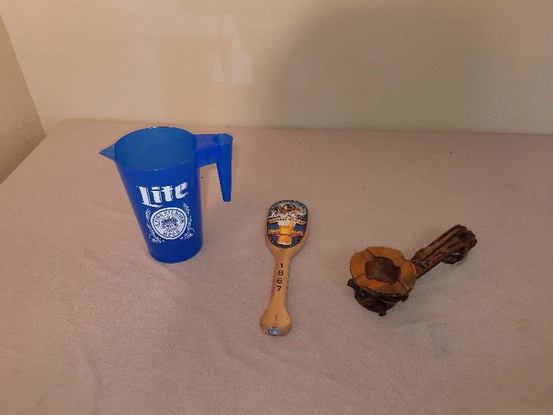 lot 164 image: lite beer pitcher, wooden pipe table piece, and beer tap handle