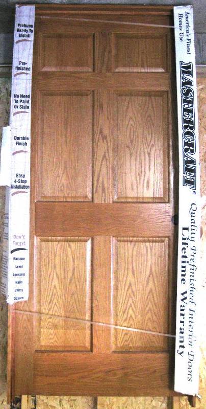 lot 041 image: New, 36 Prefinished LightMedium Oak Wood Panelled Door with Frame