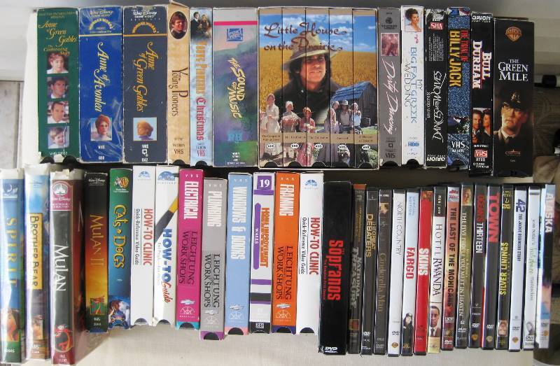 lot 075 image: Laundry Basket filled with VHS Movies & DVDs
