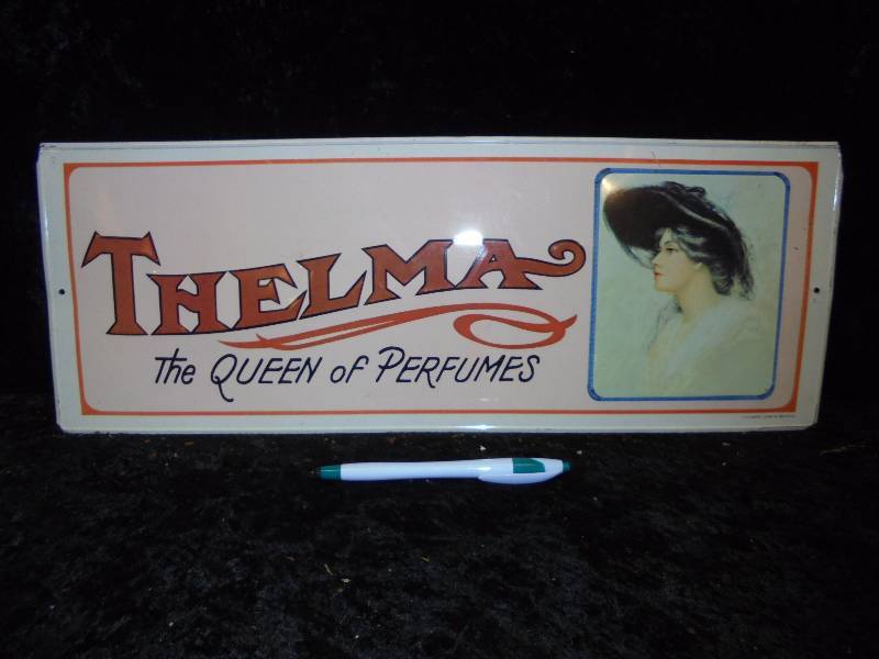 lot 9 image: Thelma Queen of Perfumes Metal Sign, 7x19
