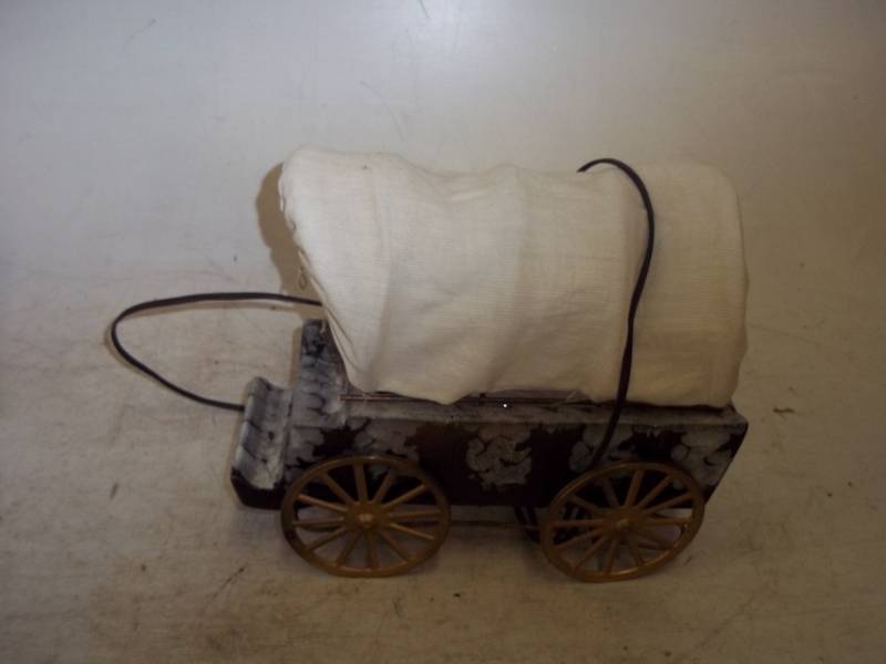 Lighted covered wagon with light