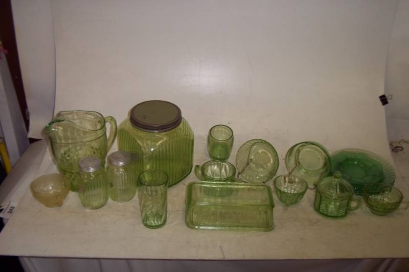 17 Piece green glass assortment, pitcher, glasses, plates,saltpepper shakers, canister etc.
