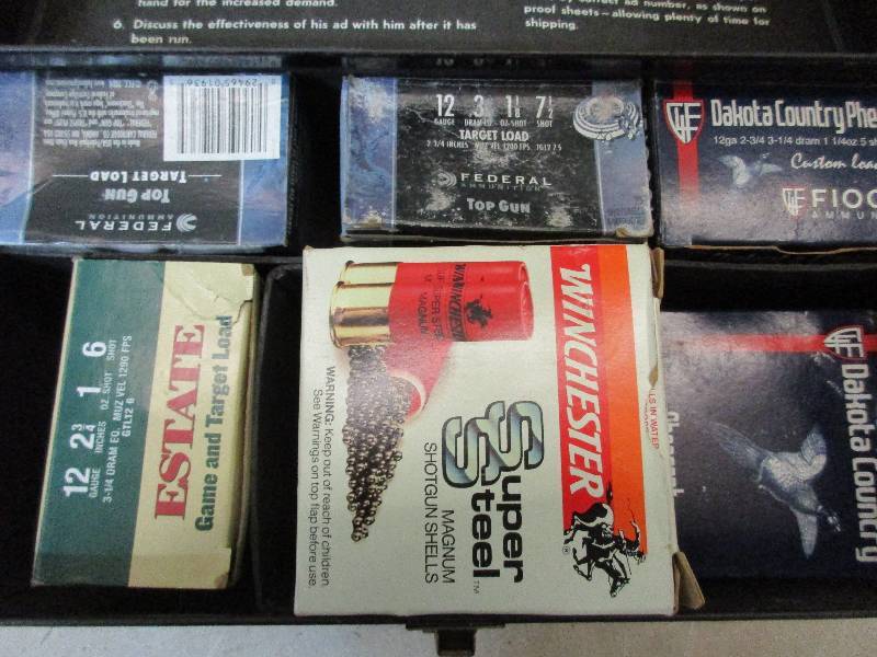 lot 83 image: 12 gauge shotgun shells and case