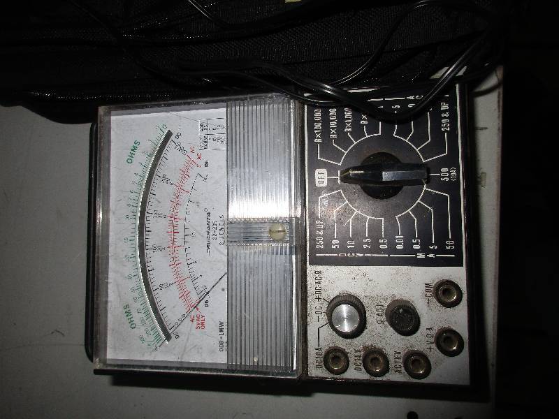 lot 182 image: roller blades and pads, seed spreader, fiber optic musical scene