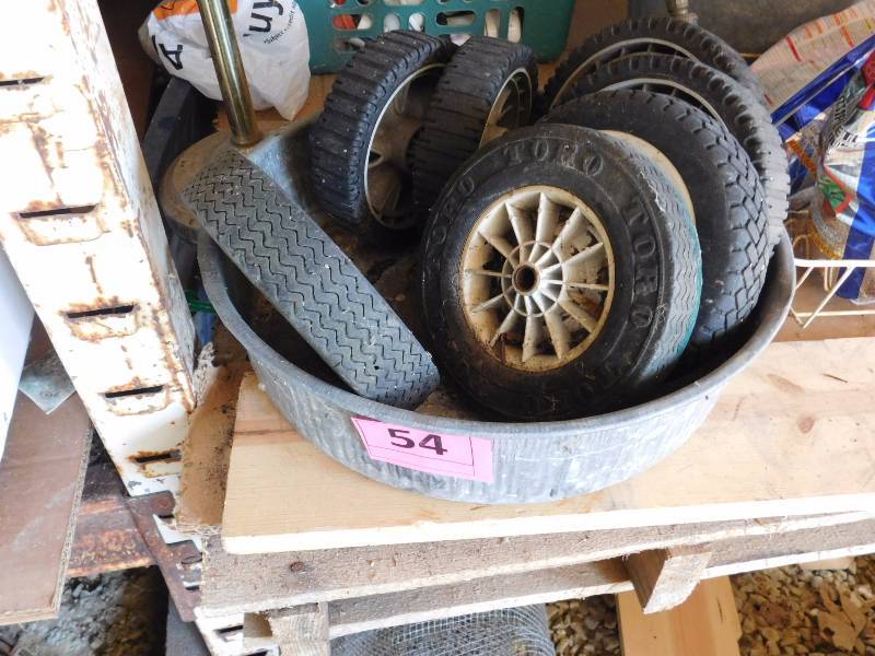 lot 54 image: galvenized wide pail filled with mics wheels