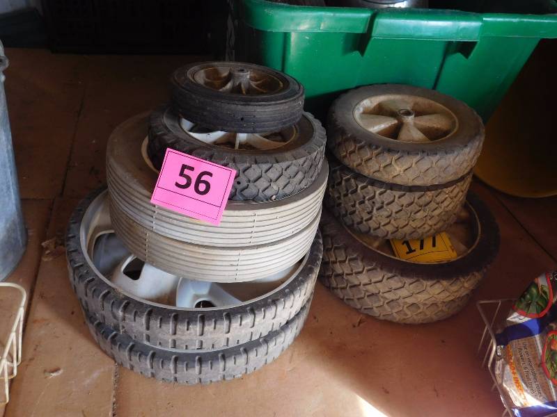 lot 56 image: stack of larger misc wheels all useful