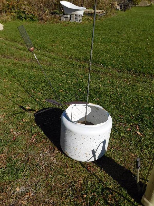 lot 100 image: vintage washing machine drum and yard art