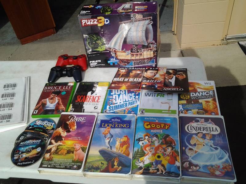 lot 44 image: Tote Full Of Wii & Other Video Games, Controllers, DVDs, Videos, 3-D Puzzle
