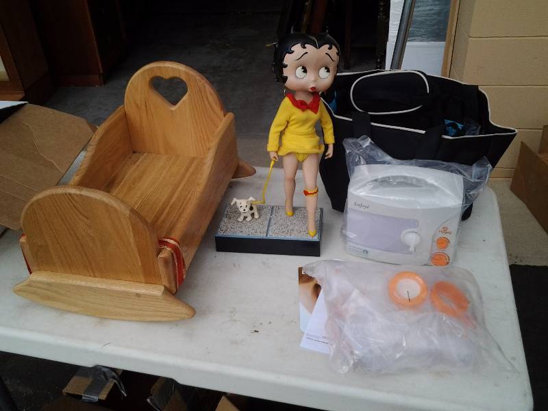 lot 56 image: Porcelain Betty Boop Doll, Wood Doll Cradle, Breast Pump