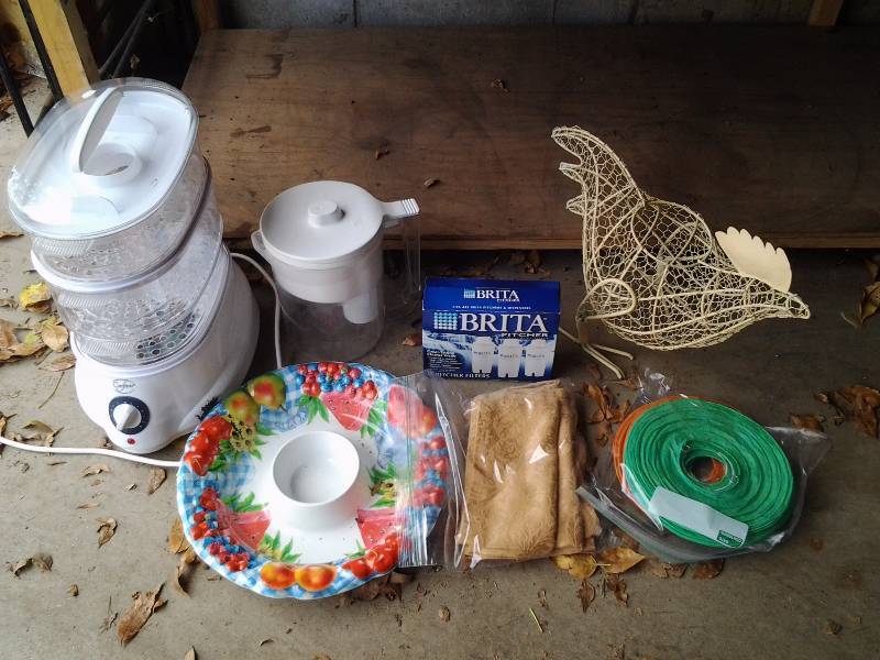 lot 28 image: Crofton Food Dryer, Brita Water Water Filter Pitcher With 3 Filters, Paper Lanterns, Wire Chicken