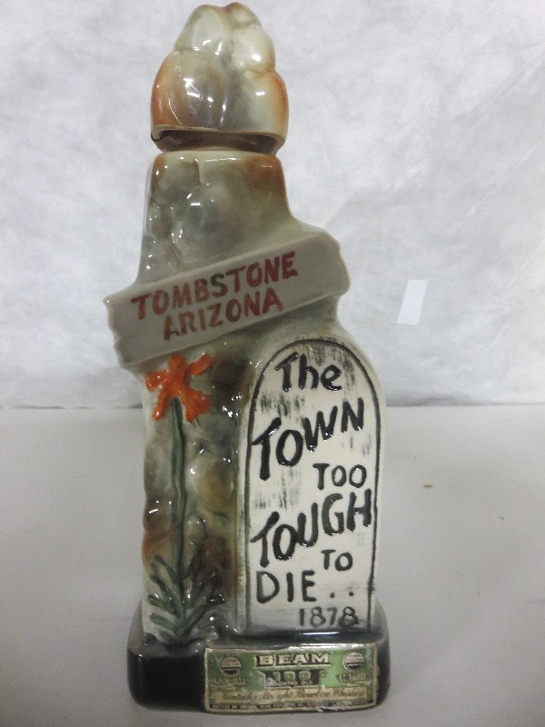 lot 14 image: Tombstone Jim Beam Container