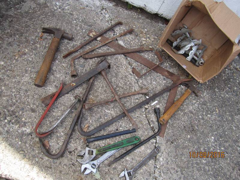 Lot of pry bars hammers and tools...