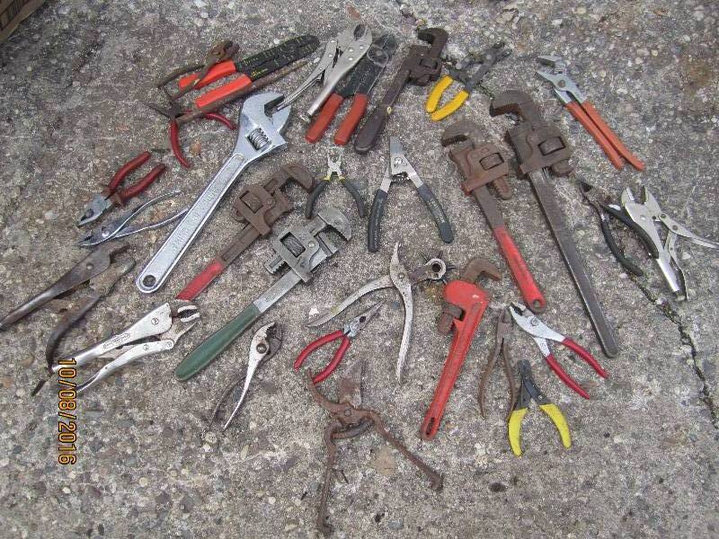 Lot of wrenches and pliers and cutt...