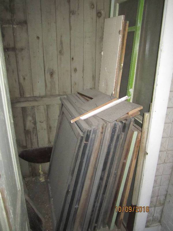 Closet full of antique shelves wind...